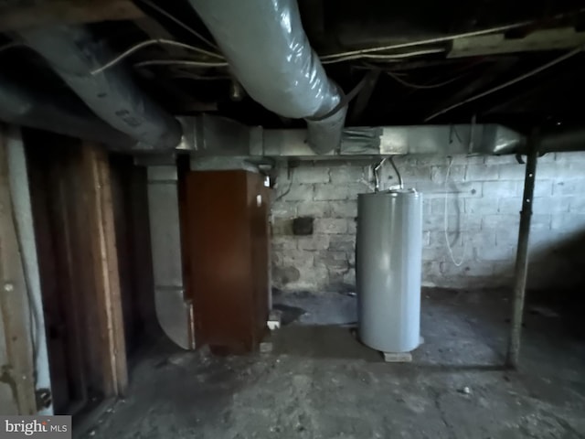 unfinished basement with gas water heater