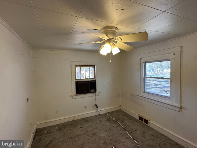 unfurnished room with baseboards, visible vents, and a wealth of natural light