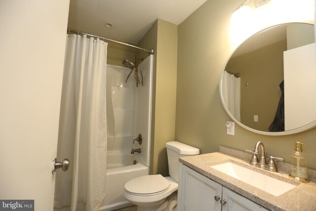 bathroom with toilet, vanity, and shower / bath combo with shower curtain