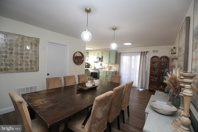 dining room featuring dark wood-style floors and visible vents