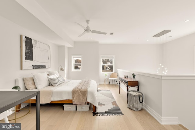 bedroom featuring recessed lighting, baseboards, wood finished floors, and a ceiling fan