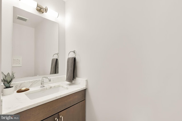 bathroom with vanity and visible vents