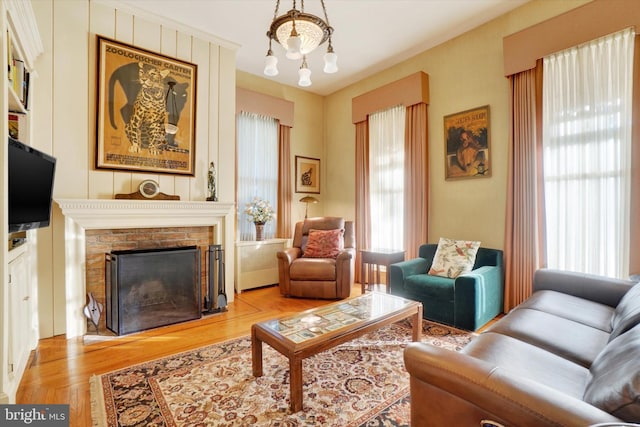 living area with wood finished floors and a fireplace