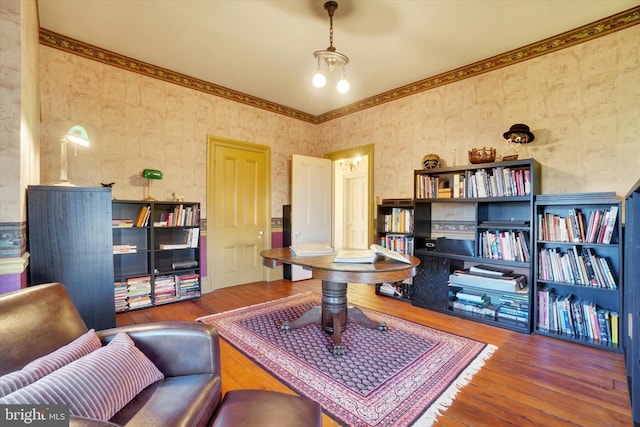 office featuring hardwood / wood-style floors and wallpapered walls