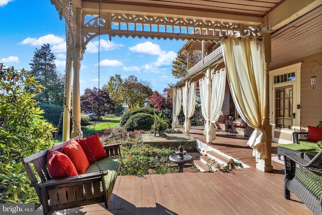 wooden deck with an outdoor hangout area