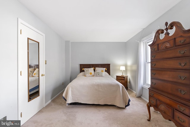 bedroom with baseboards and carpet floors