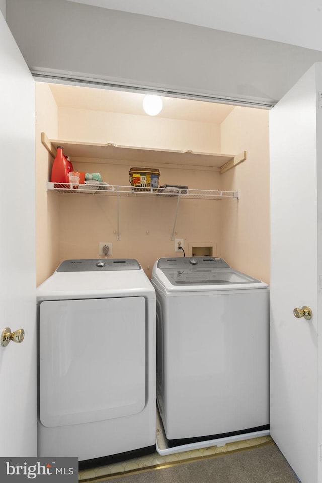 laundry area with separate washer and dryer and laundry area