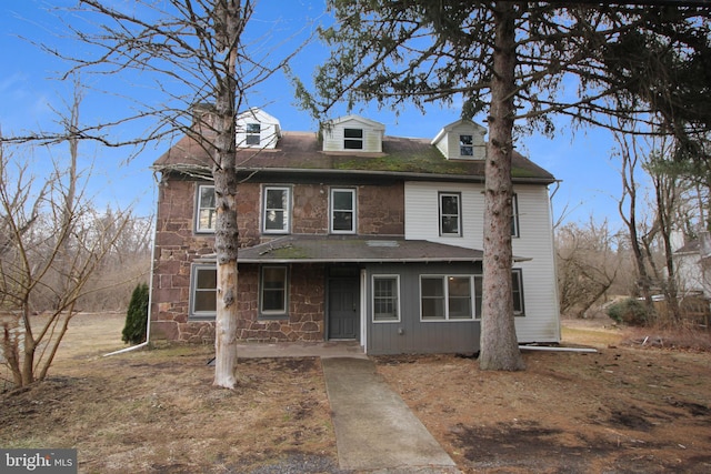 view of front of home with stone siding