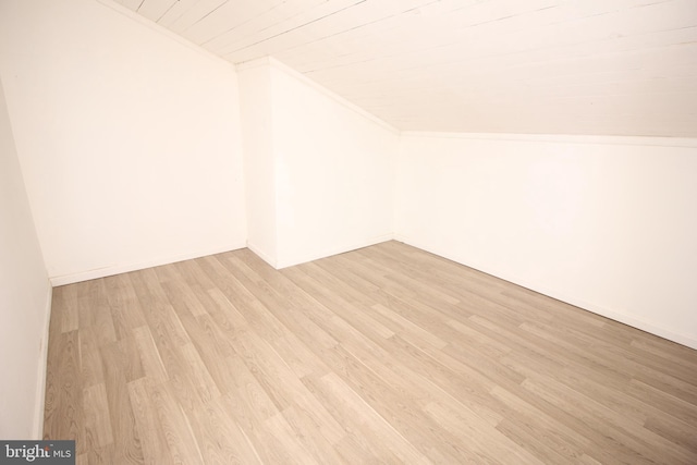 bonus room featuring lofted ceiling, light wood-style floors, and wooden ceiling