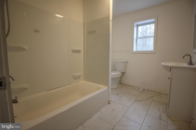 full bathroom featuring baseboards, washtub / shower combination, toilet, marble finish floor, and vanity