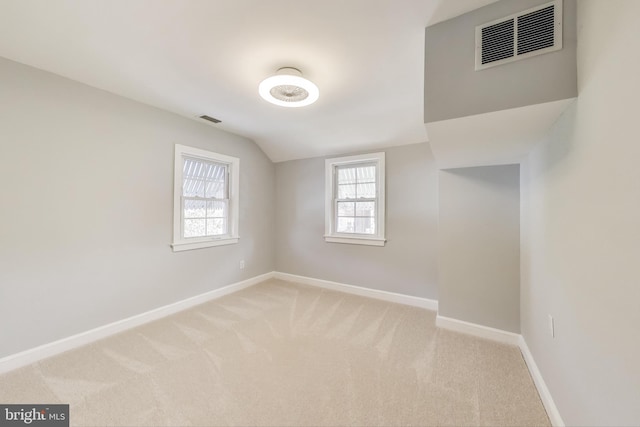 2011 Wardman Rd, Hyattsville, MD 20782 - empty room with visible vents, light colored carpet, lofted ceiling, and baseboards