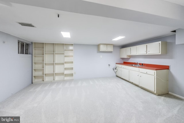 2011 Wardman Rd, Hyattsville, MD 20782 - interior space featuring a sink, visible vents, and light colored carpet