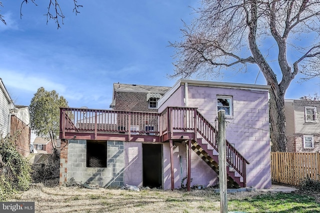 2011 Wardman Rd, Hyattsville, MD 20782 - rear view of house with stairway, a wooden deck, and fence