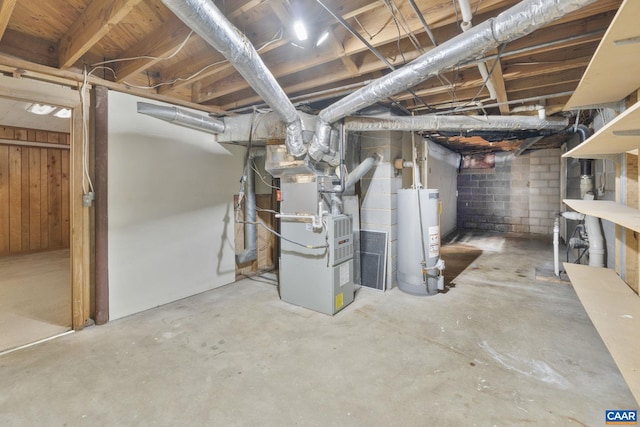 unfinished basement featuring gas water heater and heating unit