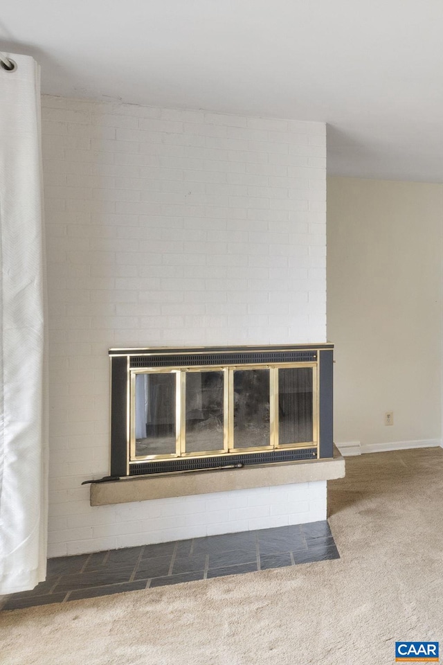 details with a brick fireplace and carpet