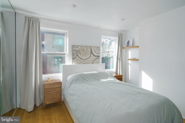 bedroom featuring wood finished floors