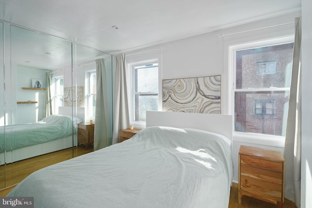 bedroom with wood finished floors