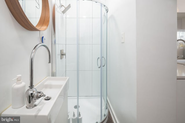 bathroom featuring a stall shower and vanity