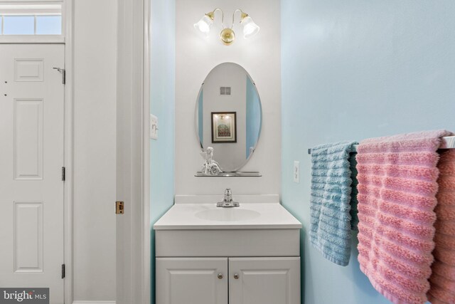 bathroom featuring visible vents and vanity