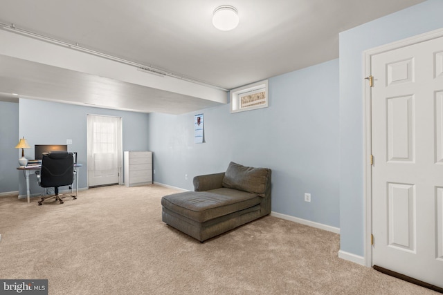 sitting room with baseboards and carpet floors