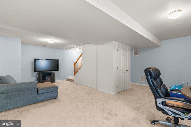 office area with visible vents, baseboards, and carpet flooring