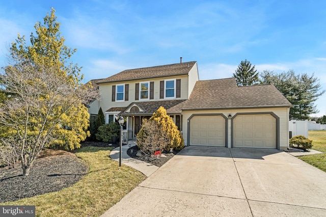 traditional home with a front yard, fence, driveway, roof with shingles, and an attached garage