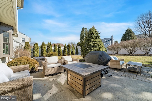 view of patio / terrace featuring an outdoor living space, a grill, and fence