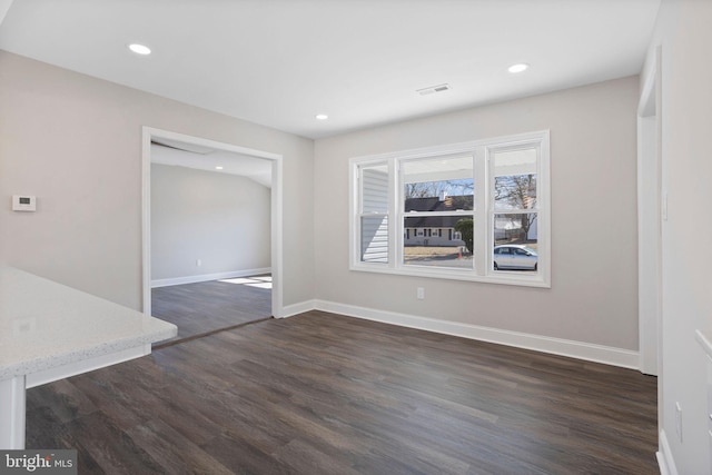 unfurnished dining area featuring visible vents, recessed lighting, baseboards, and dark wood-style flooring