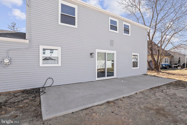 back of property featuring a patio area