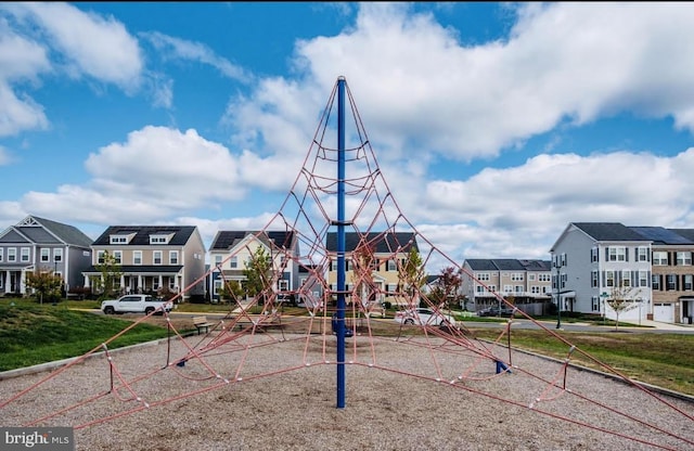 surrounding community with a residential view and playground community