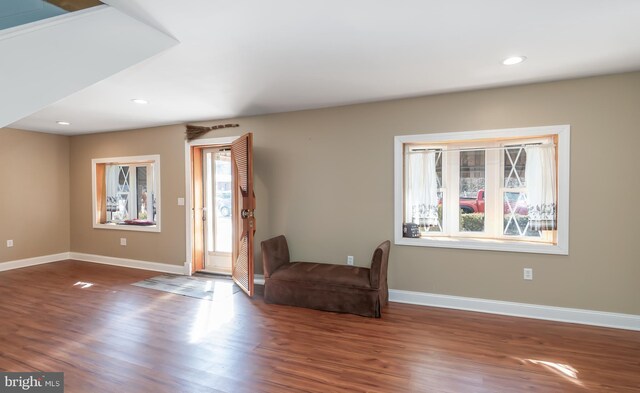 entryway with recessed lighting, baseboards, and wood finished floors