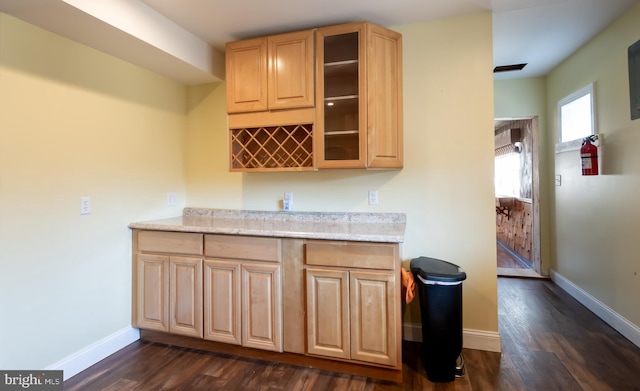 kitchen with glass insert cabinets, baseboards, dark wood-style floors, and light brown cabinets