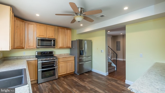 kitchen with visible vents, ceiling fan, light countertops, dark wood-type flooring, and appliances with stainless steel finishes