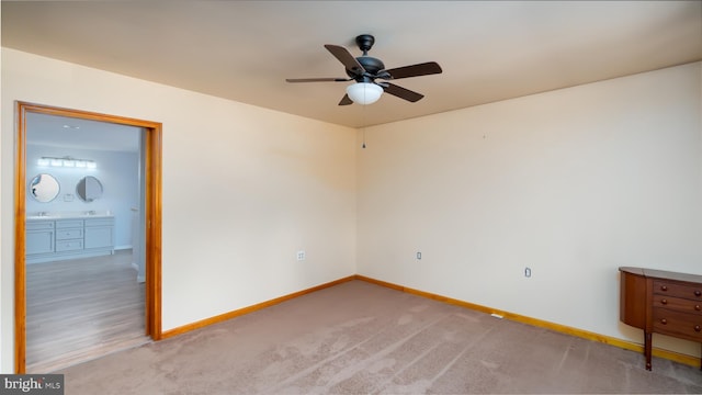 unfurnished bedroom with baseboards and light carpet