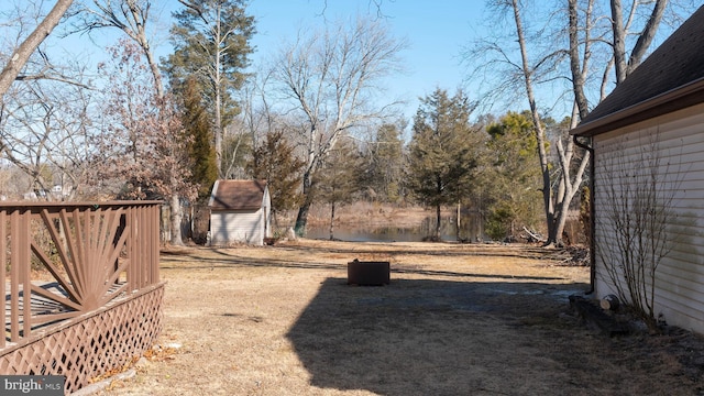 view of yard featuring an outbuilding and a shed