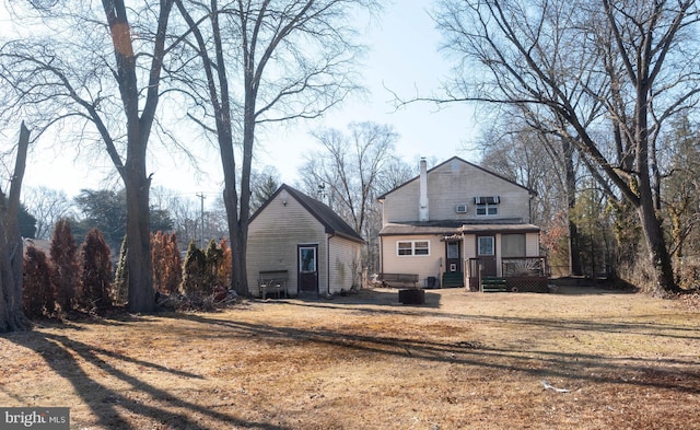 rear view of house featuring a deck