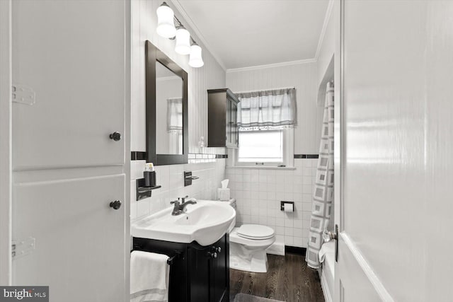 802 E 11th Ave, York, PA 17402 - full bathroom featuring toilet, wood finished floors, tile walls, crown molding, and vanity