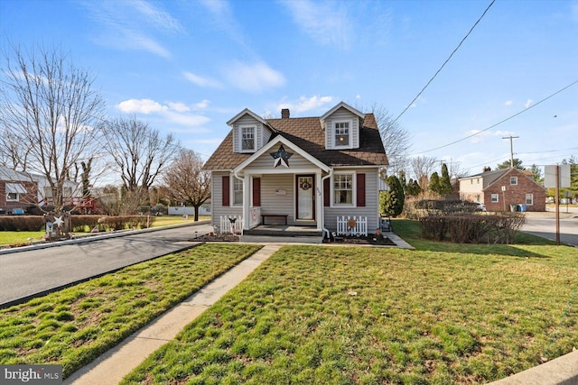 802 E 11th Ave, York, PA 17402 - bungalow-style house featuring a front yard and a chimney