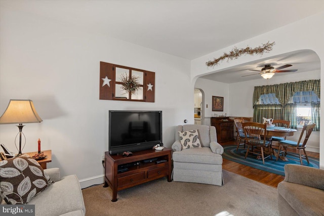 802 E 11th Ave, York, PA 17402 - living room with a ceiling fan, arched walkways, and baseboards