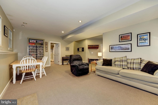 living room featuring recessed lighting, baseboards, and carpet