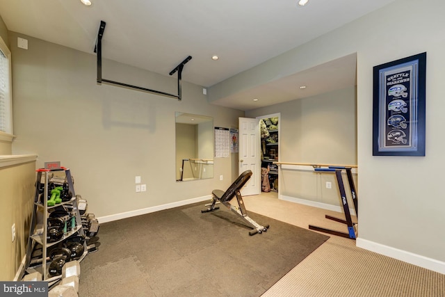 exercise room with recessed lighting and baseboards