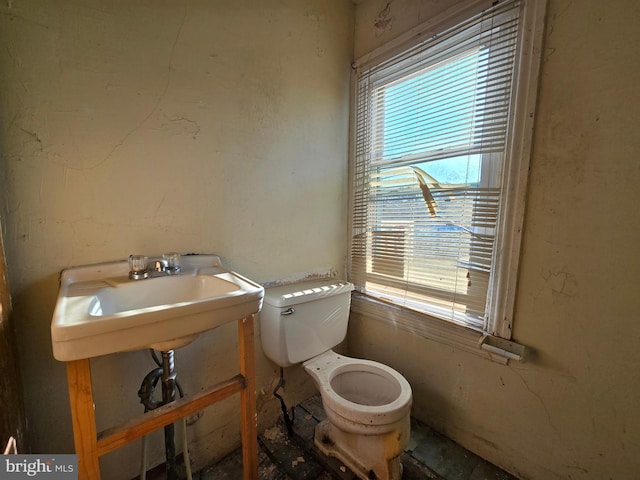 half bathroom with a sink and toilet