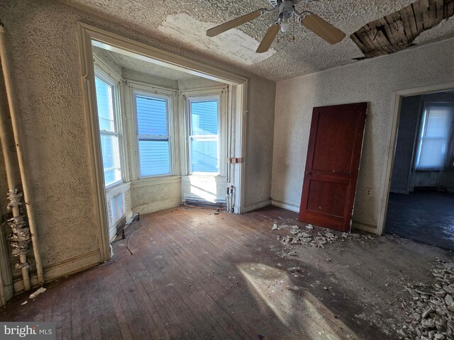 unfurnished room with wood-type flooring