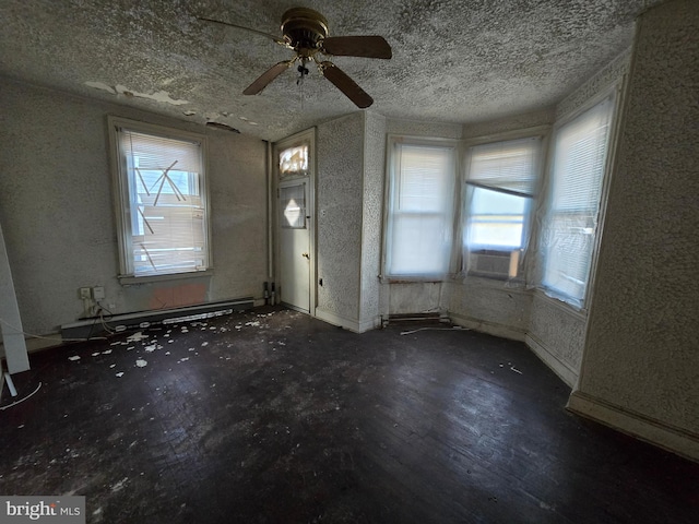 entrance foyer featuring cooling unit, a textured ceiling, and a baseboard radiator