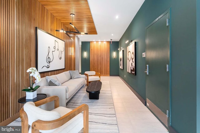 cinema room featuring recessed lighting, wooden walls, and tile patterned floors