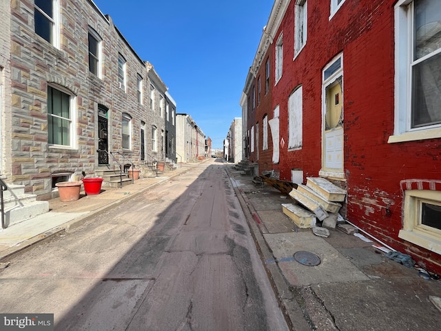 view of street with sidewalks, curbs, and entry steps