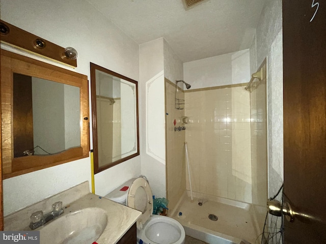 full bath with a shower stall, toilet, and vanity