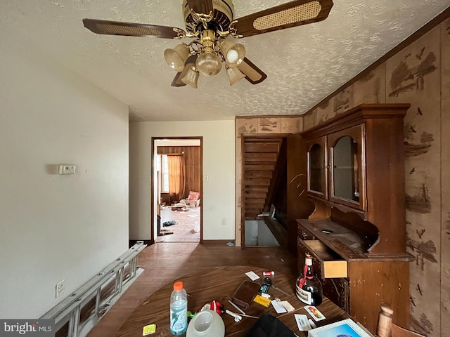 interior space featuring wood finished floors and a textured ceiling