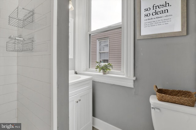 bathroom featuring toilet and vanity