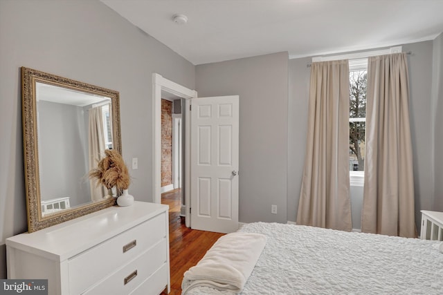 bedroom featuring dark wood-style floors